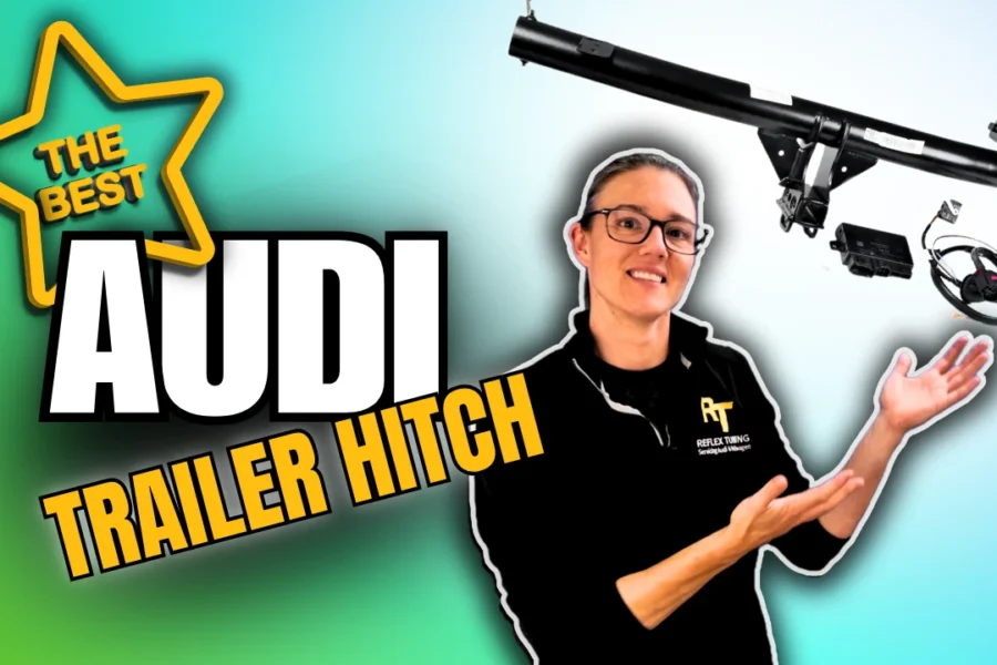 Audi VW Service A person wearing glasses and a black shirt gestures toward a car trailer hitch, with bold text reading The Best Audi Trailer Hitch against a gradient background. Reflex Tuning, Hookett NH