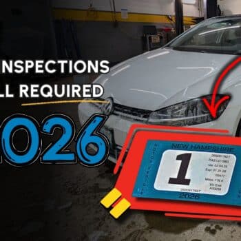 White car in garage with text 'NH inspections still required 2026' and a New Hampshire inspection sticker